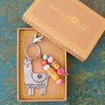 Natural Life Llama Llive Happy Santa Fe Keychain – Floral Metal with Beads