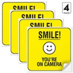 (4 Pack) Smile You’re on Camera Sign Stickers, 5.5 x 5.5 Inches, 4 Mil Vinyl Self Adhesive Decal Stickers, Long Lasting, Weatherproof and UV Protected, Made in USA by SIGO SIGNS