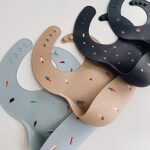 mushie Silicone Baby Bib | Adjustable Fit Waterproof Bibs (Retro Cars)